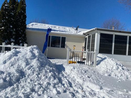 Snow Sweeping Tools On The Roof photo review