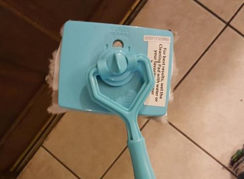 White Baseboard Buddy Multi-Use Cleaning Tool with Retractable Brush photo review