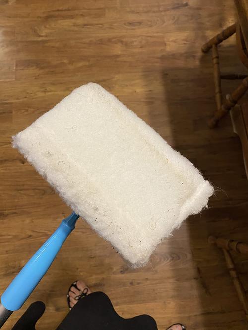 White Baseboard Buddy Multi-Use Cleaning Tool with Retractable Brush photo review