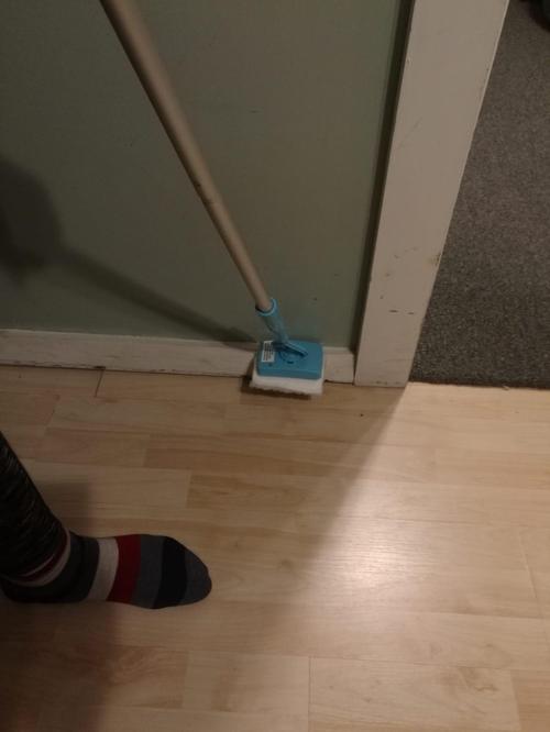 White Baseboard Buddy Multi-Use Cleaning Tool with Retractable Brush photo review